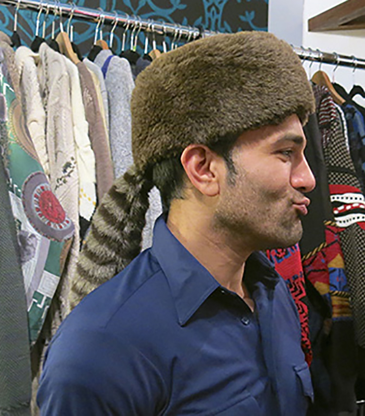 Rez models faux coonskin cap